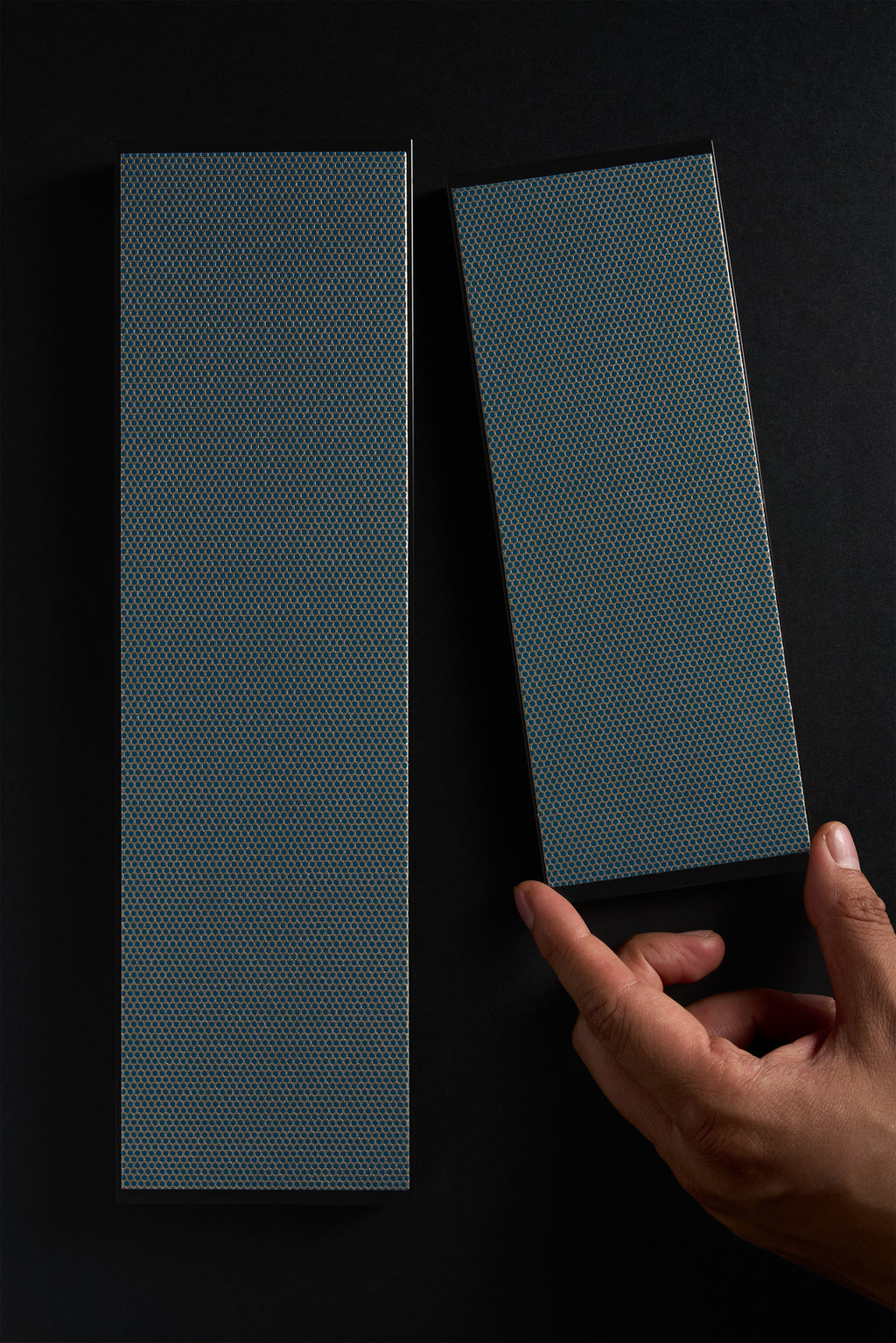 Regular and extra-large Zen-Wu diamond flattening stones, with a hand holding the regular size