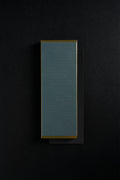 Gold Zen-Wu diamond flattening stone resting on a larger black stone