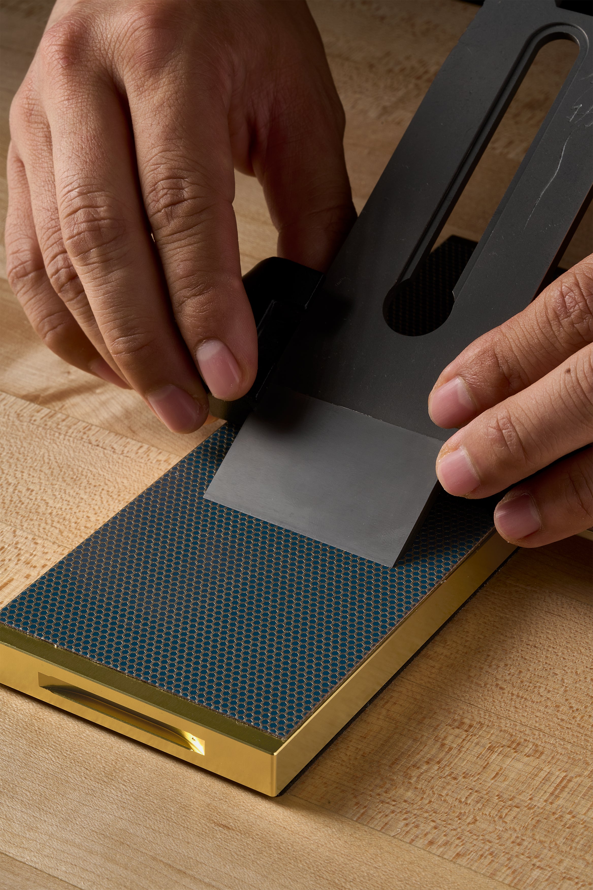 Working a plane blade on a gold Zen-Wu diamond flattening stone