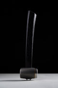 F-4 hammer with flame-anodized titanium head and brass ring, standing upright