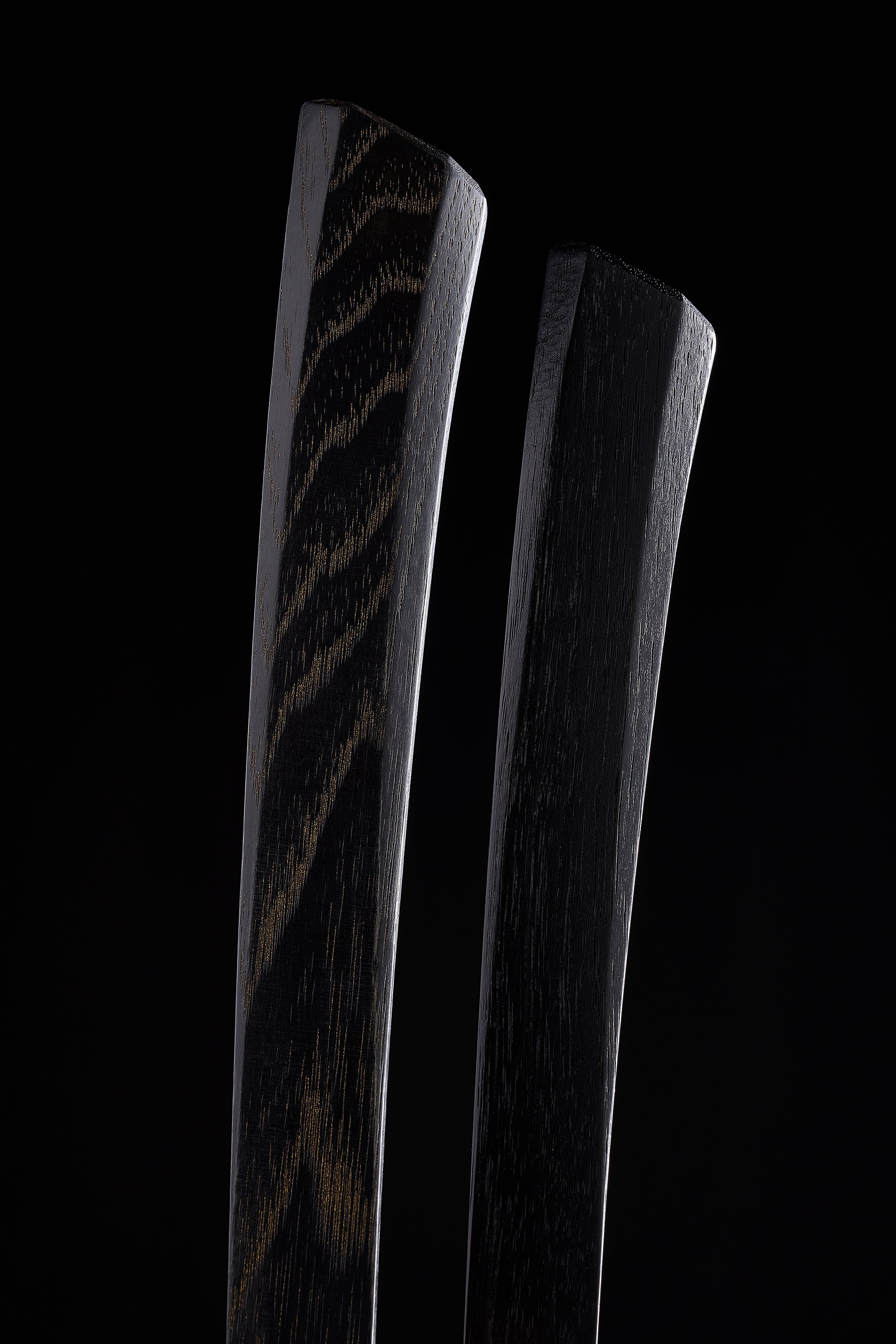 Two F-4 dyed hickory handles, grain showing through the black