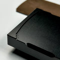 Close-up of a black ZenSharp base with an inset card and notches along the edges.