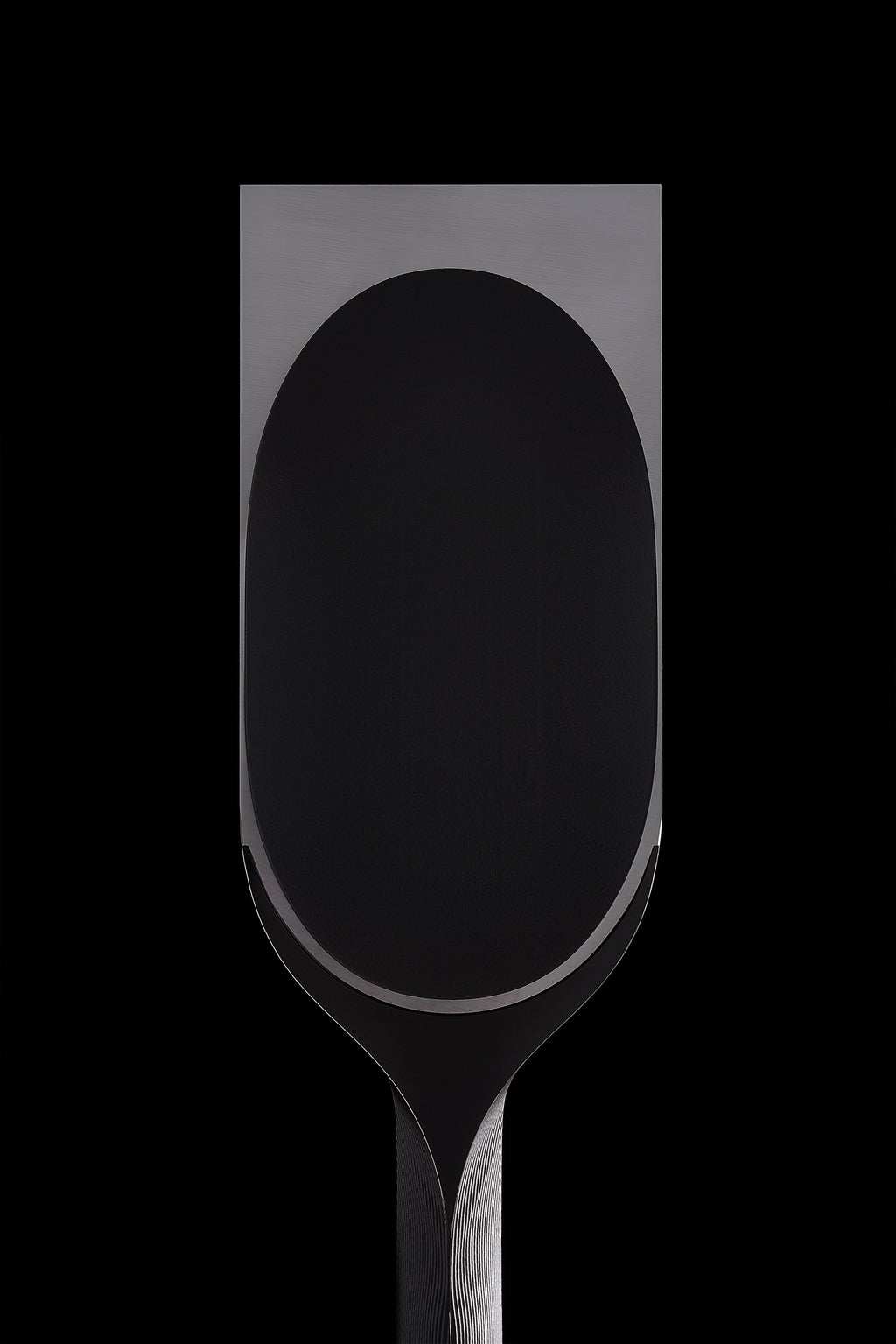 Back of the wide DC-1 blade, one long oval hollow inside a polished land
