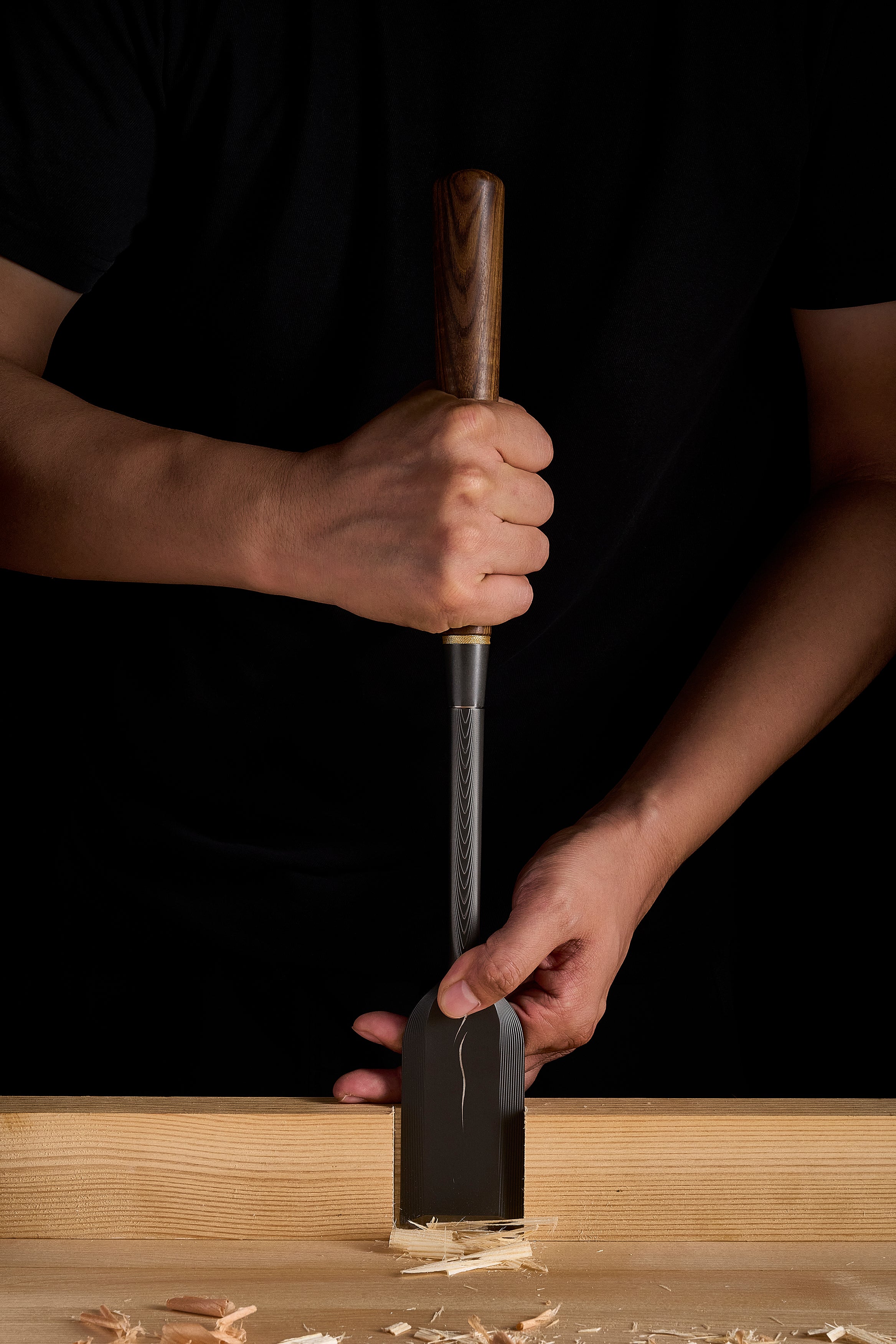 Two handed grip on the DC-1 paring chisel, paring down into a timber