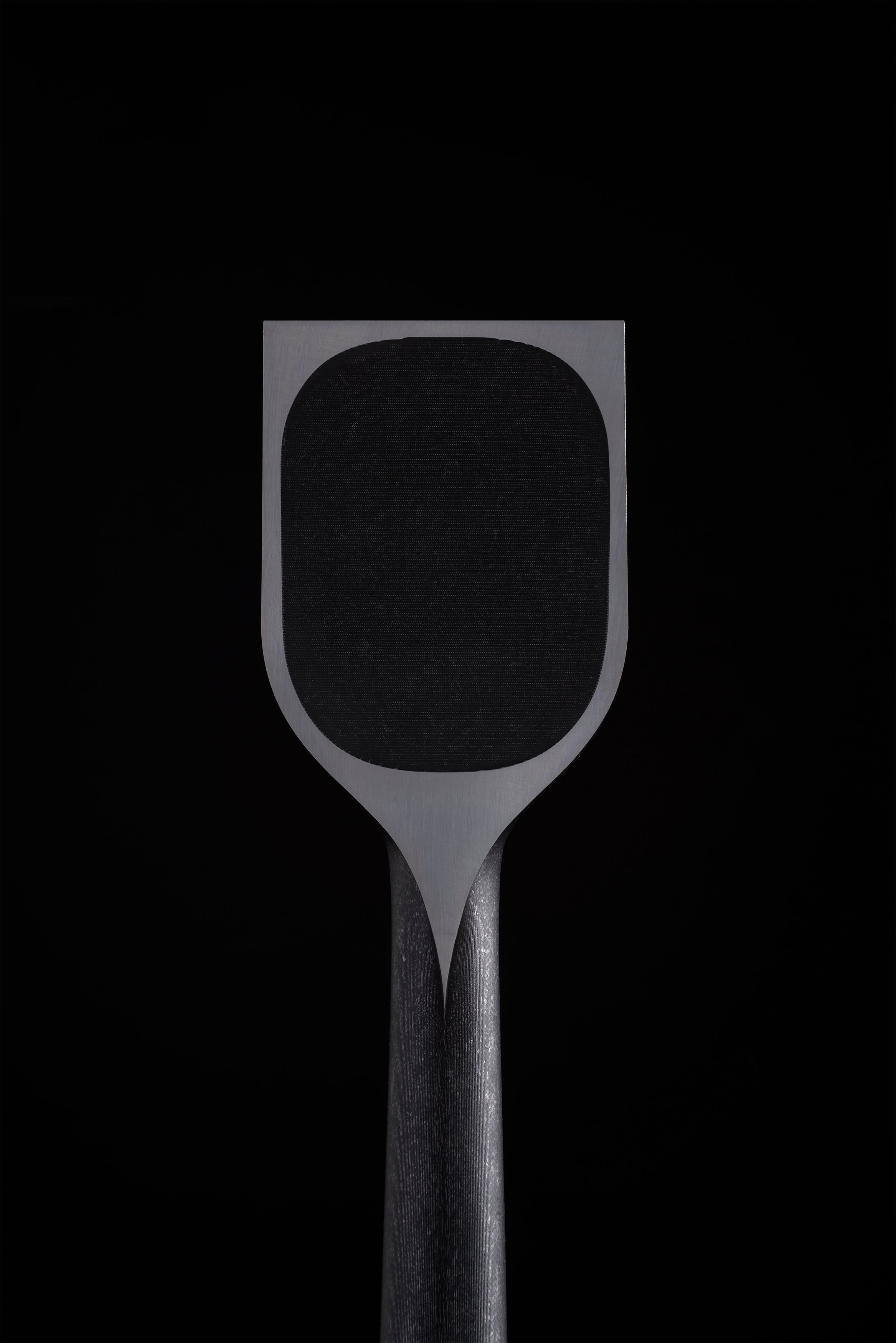 Hollowed back of a wide TB-1 chisel, flat land around the polished edge