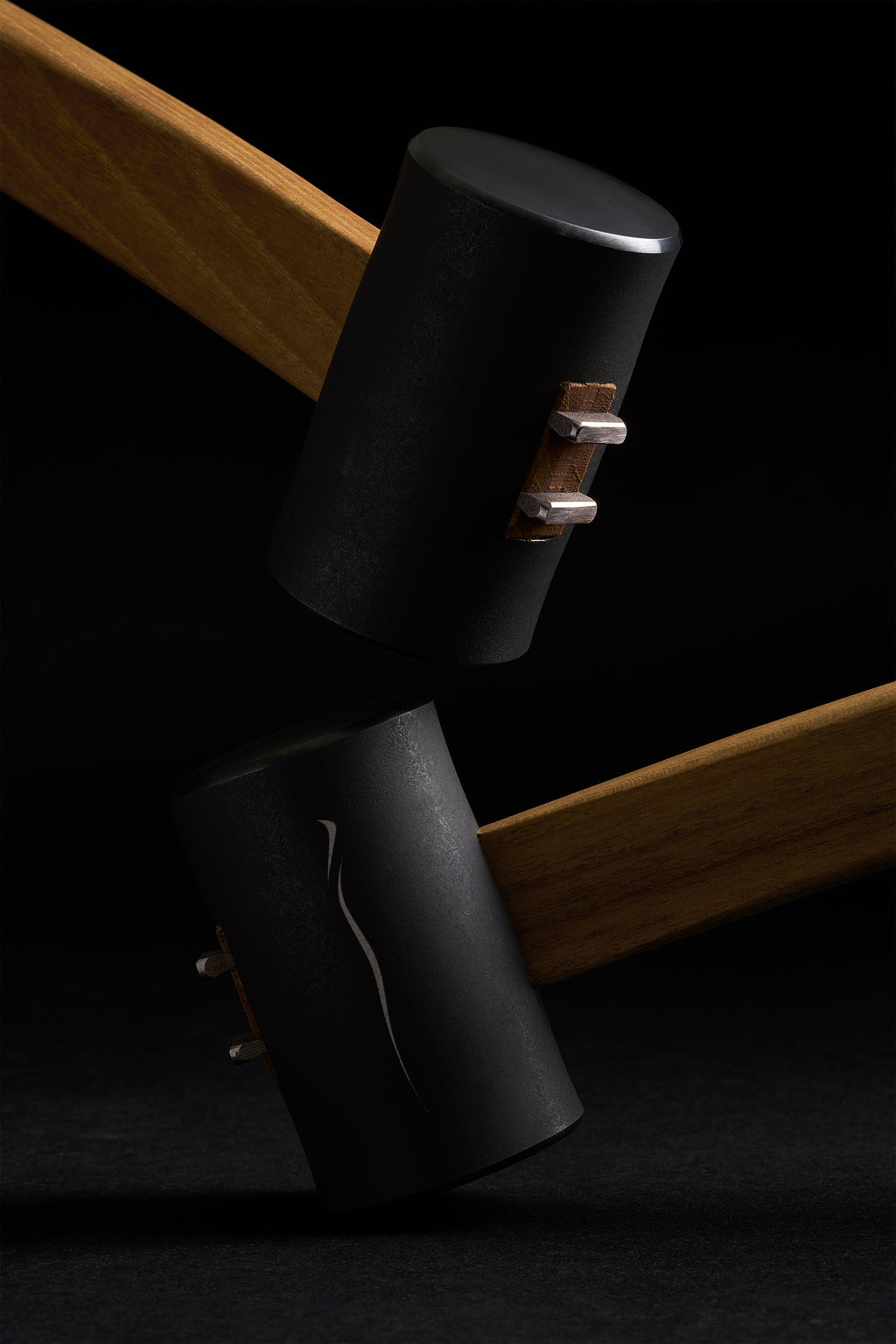 Two Zen-Wu F-3 hammer heads with the handle ends and wedges visible