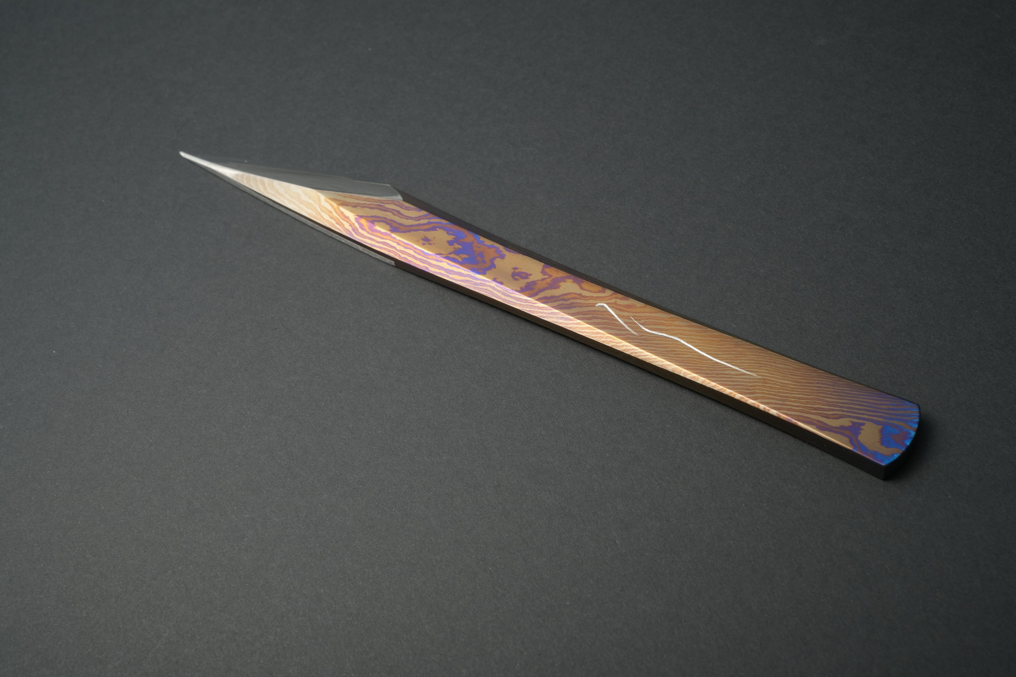 Full view showing the Damascus titanium pattern