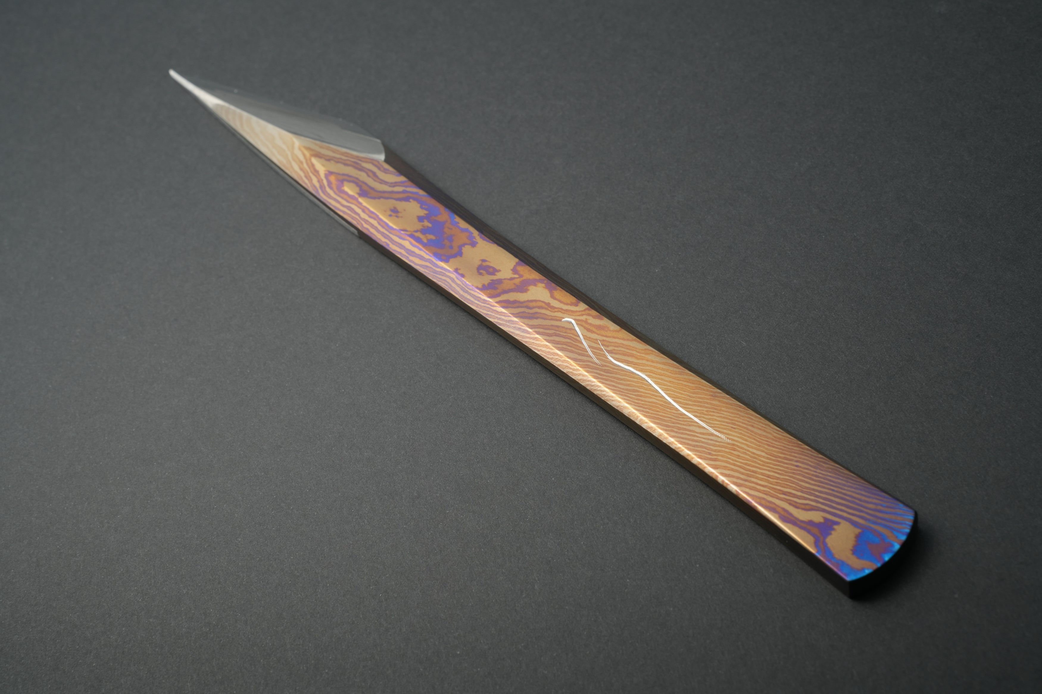 Full view, fine scratch visible on the handle